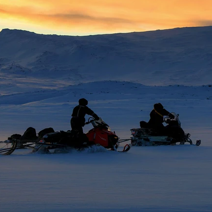group of snowmobilers on the snow